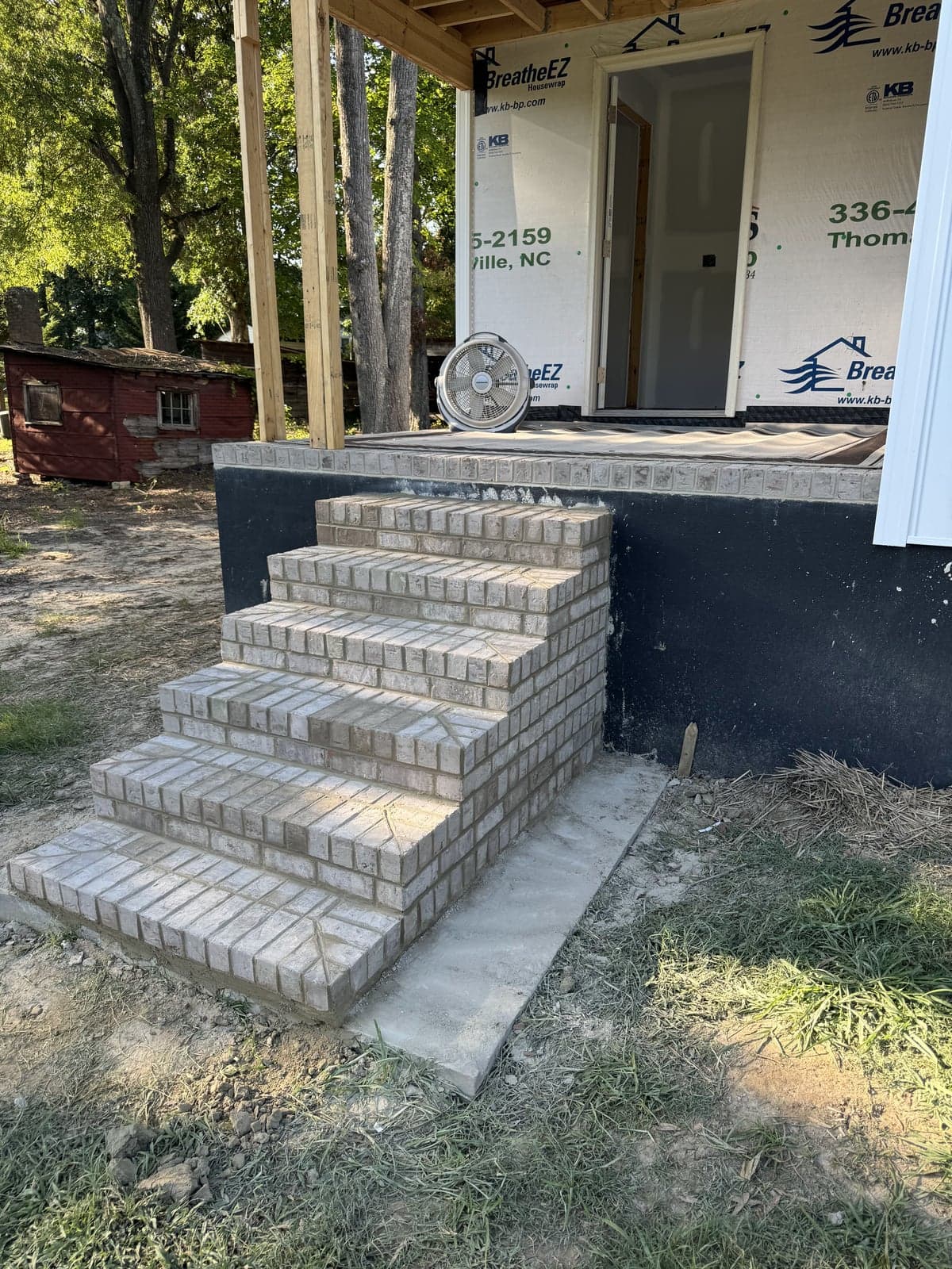 Brick stairs leading to a building entrance