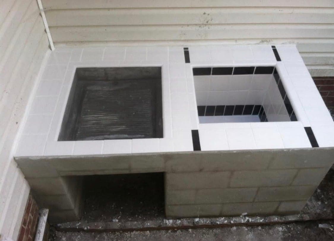 Custom outdoor kitchen base with tile detail
