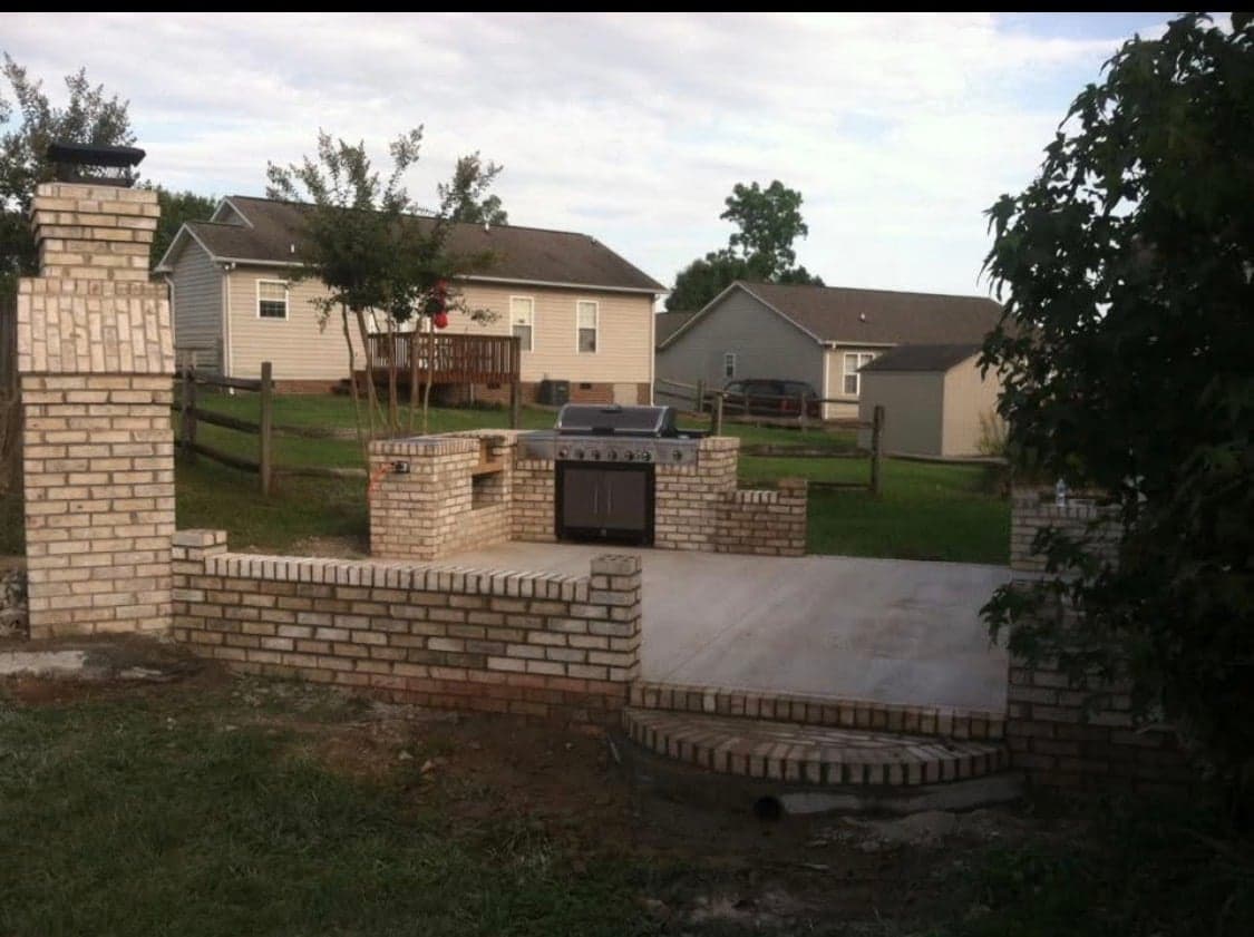 Brick outdoor kitchen with chimney column