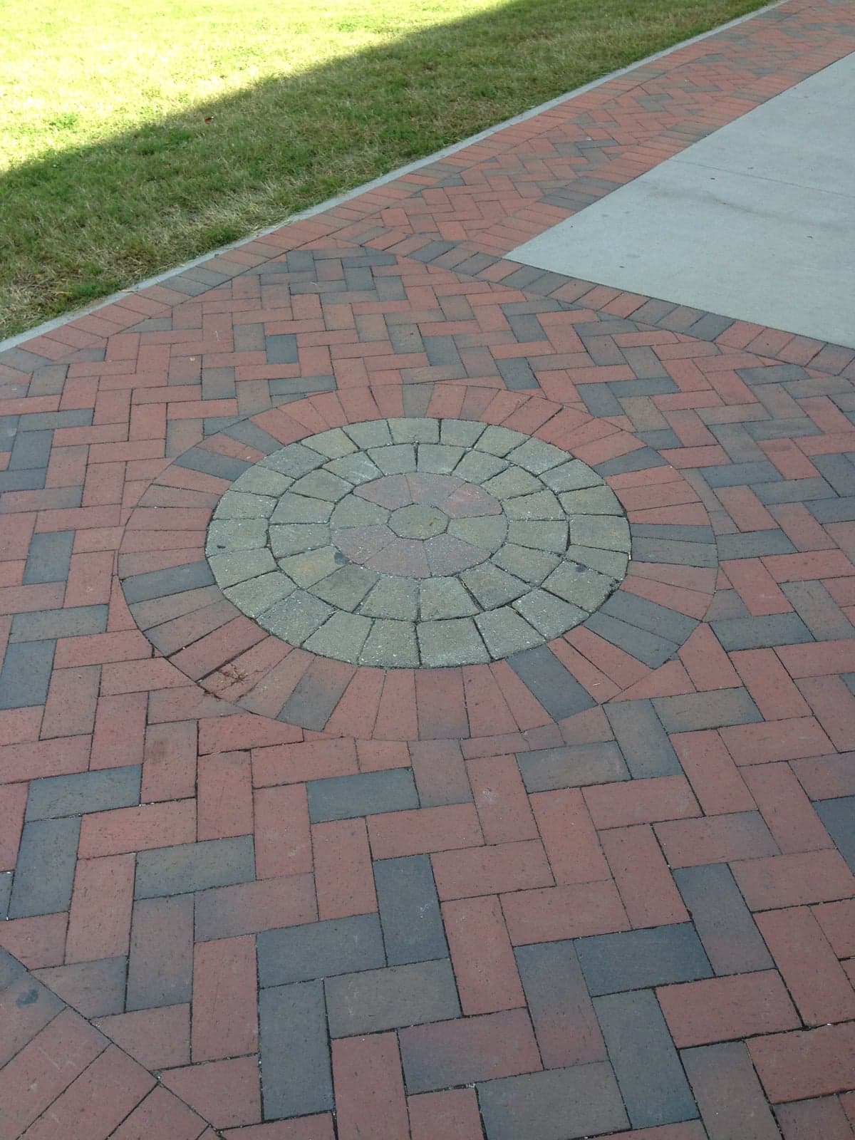 Brick paver patio with circular sun medallion