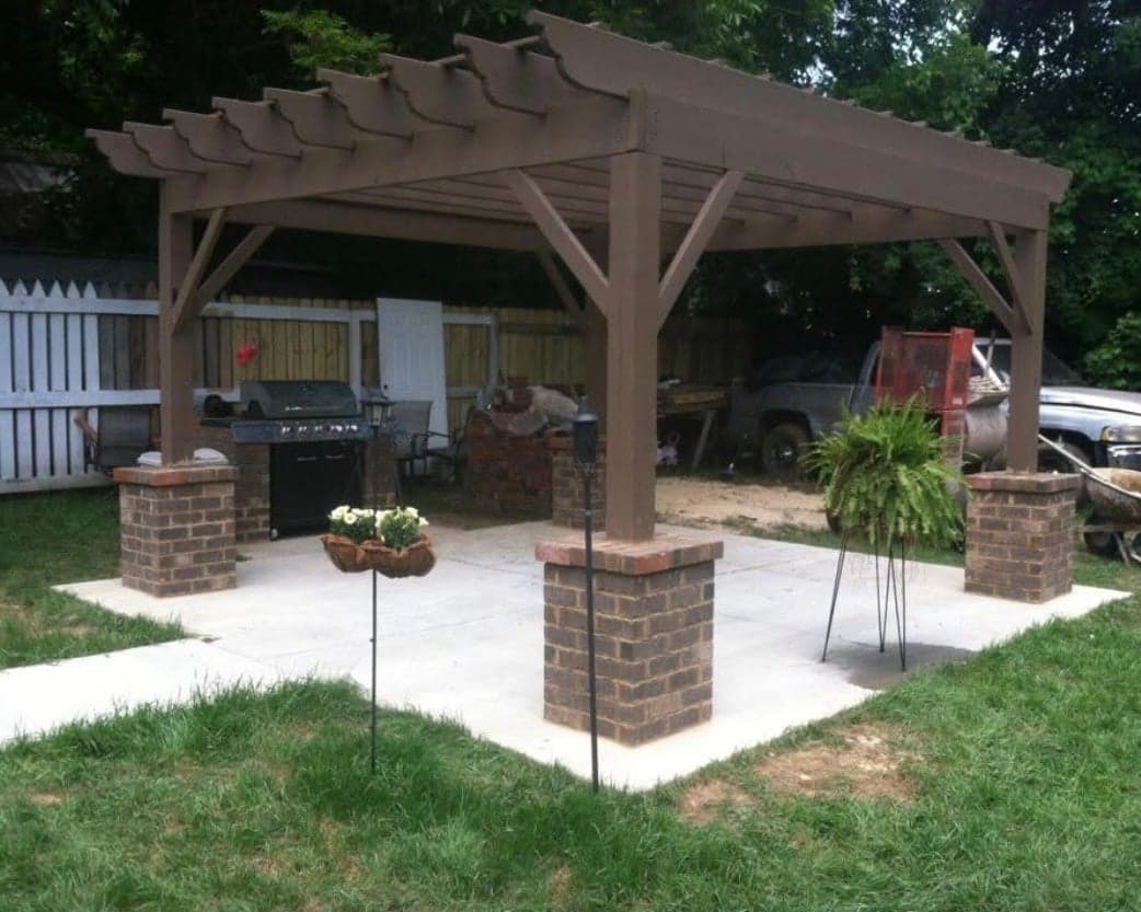 Pergola with brick column bases on a concrete pad
