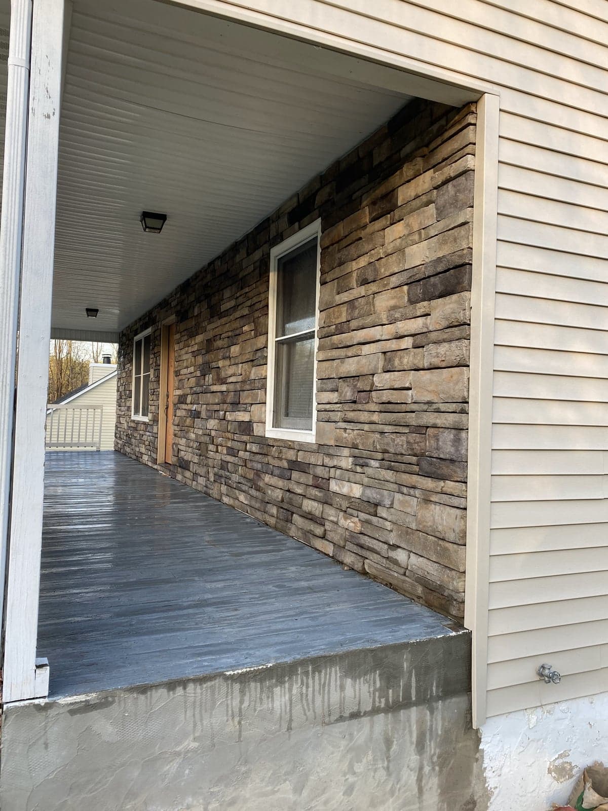 Stacked-stone porch wainscot detail