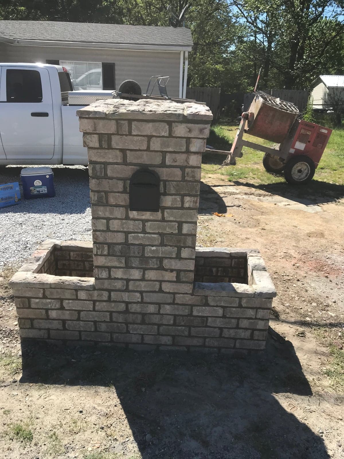 Tall stone-veneer mailbox column